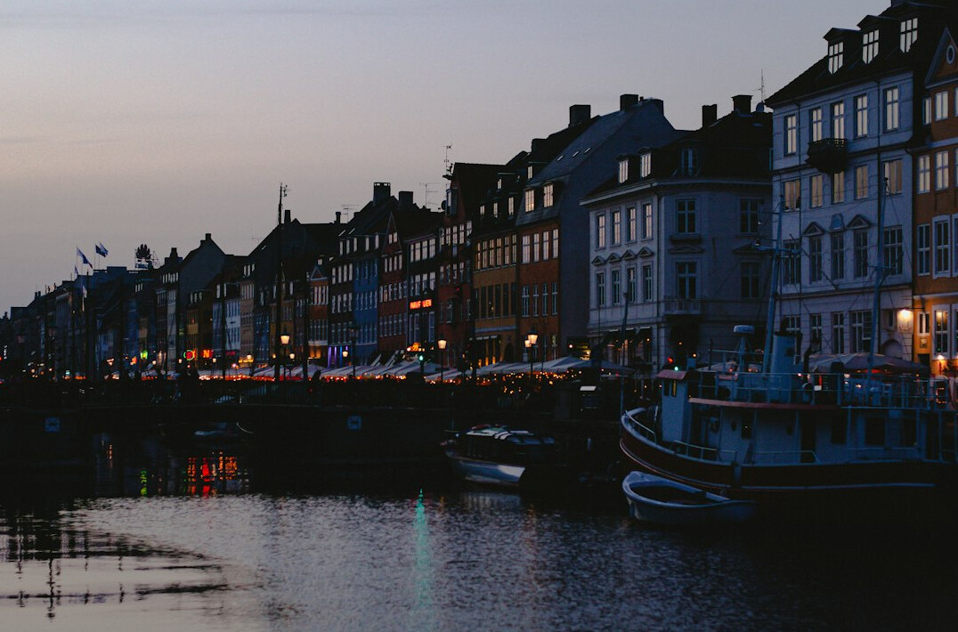 Colorful harbor houses in Nyhavn Copenhagen at dusk