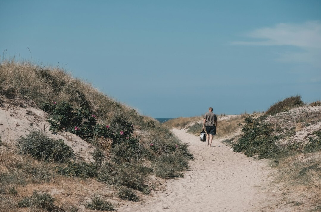 Photographer holding a camera outdoors in Denmark