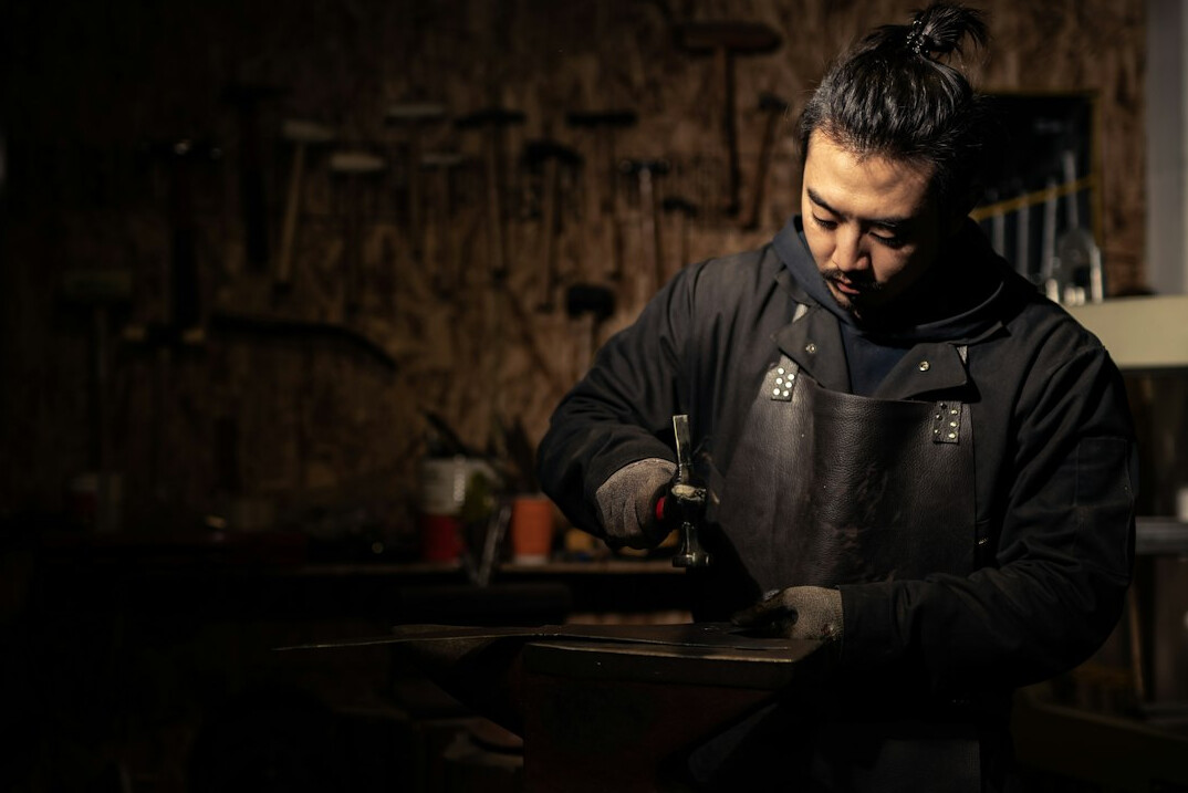 Portrait of a young Danish craftsman in his workshop